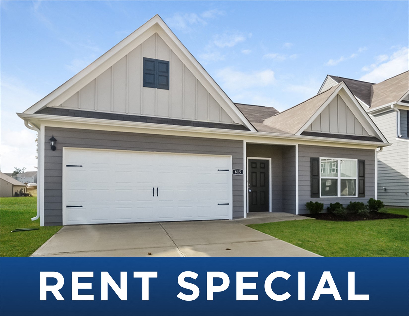 a house with the rent special sign in front of it