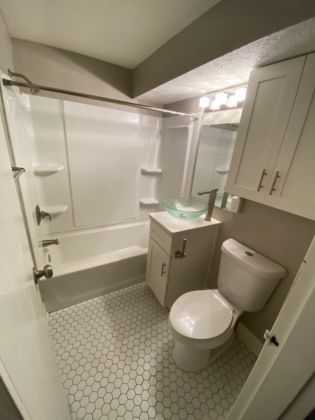 a small bathroom with a toilet and a shower
