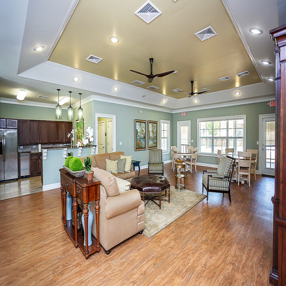 a large living room with a kitchen and a dining room