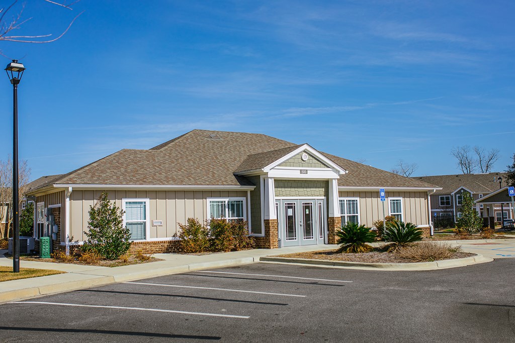 a house with a parking lot in front of it