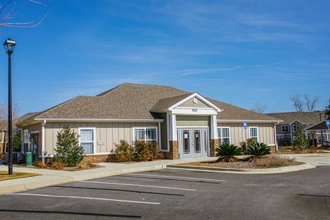 a house with a parking lot in front of it