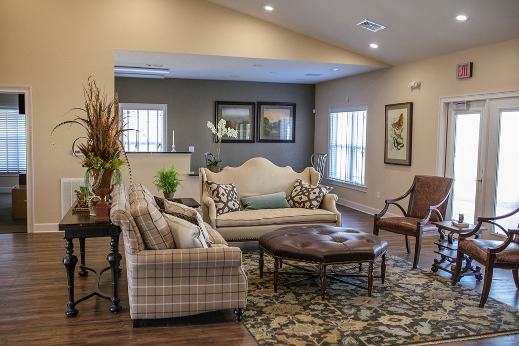 a living room with couches and chairs and a table