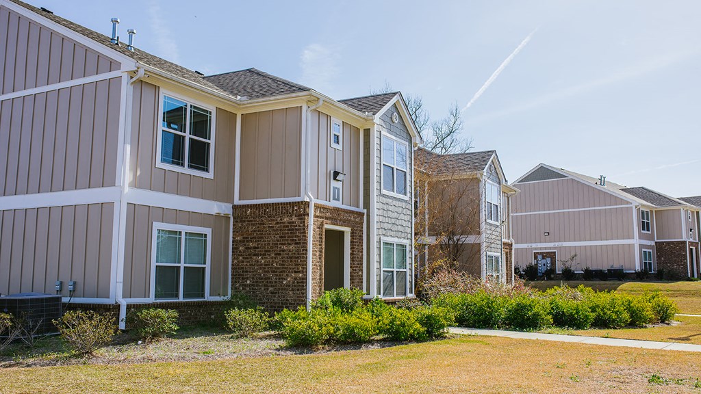 a row of town houses on a sunny day