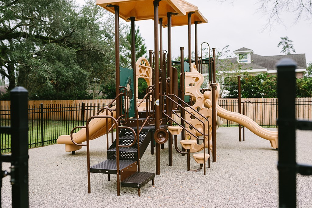 a playground with a swing set and slides