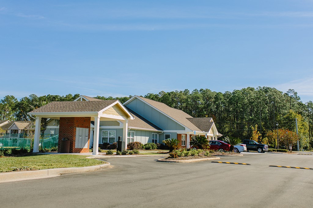 a house with a parking lot in front of it