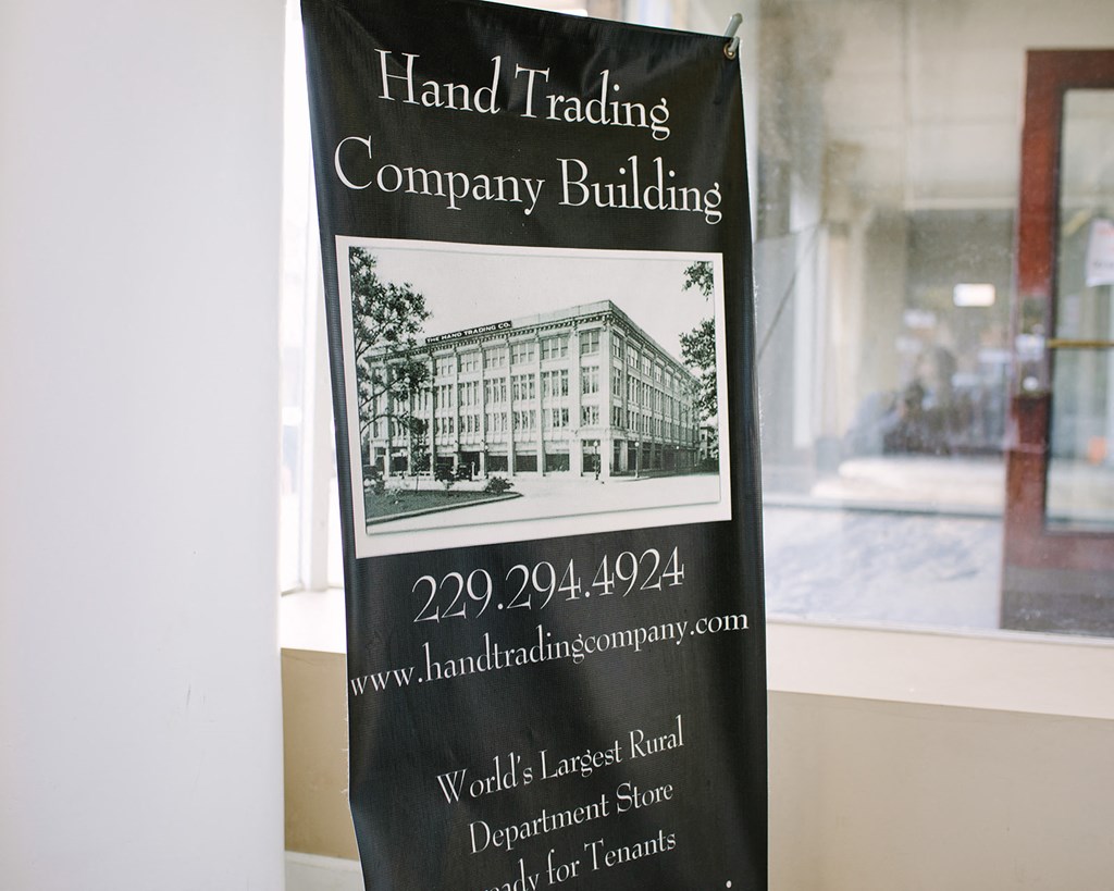 a sign for the hand trading company building