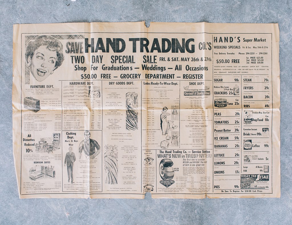 an old newspaper page with ads for hand trading and a schedule