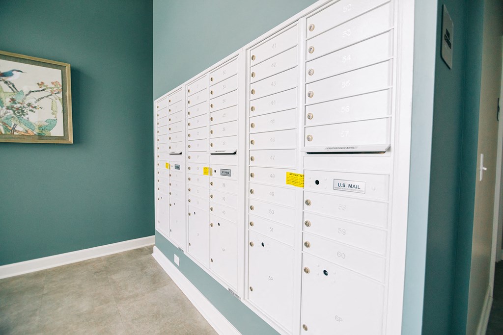 a row of white lockers in a room with blue walls