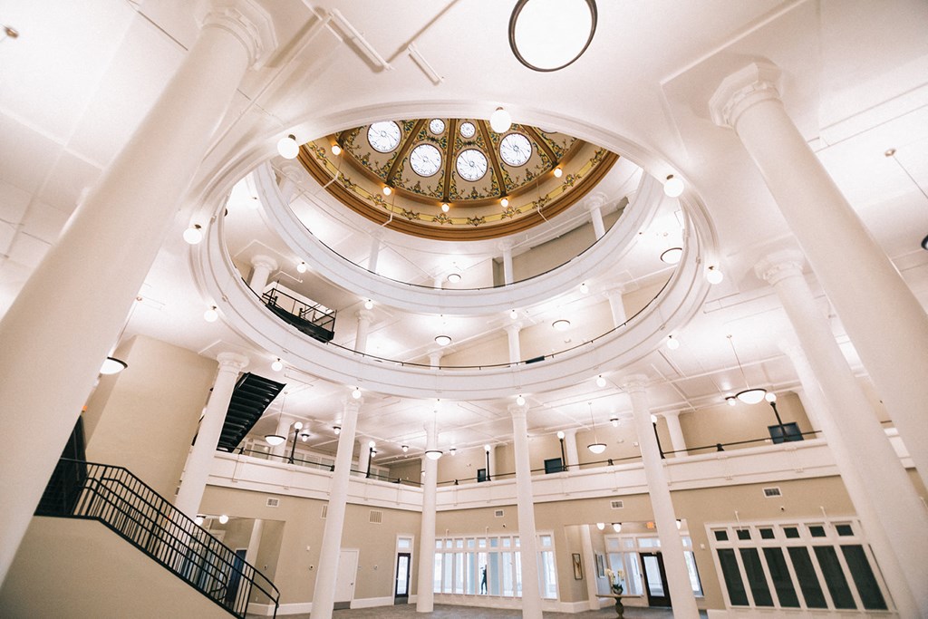 the inside of a large building with a domed ceiling