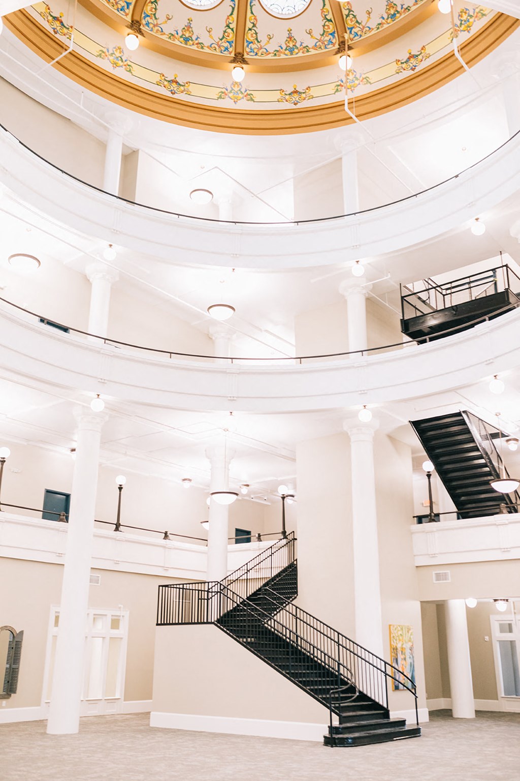 the inside of a large building with a spiral staircase