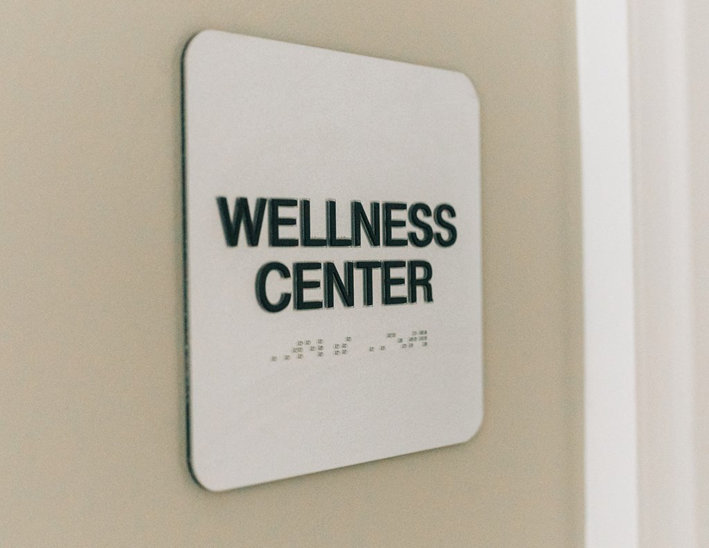 a wellness center sign on a wall