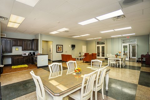 a conference room with a table and chairs