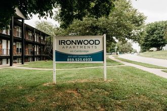 a sign for ironwood apartments in front of a building