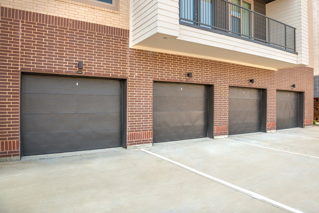 three garage doors on the side of a building