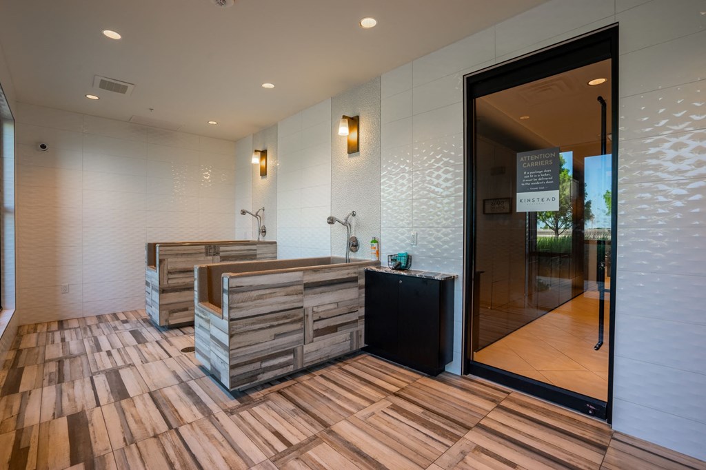 the spa has a large shower and wood flooring