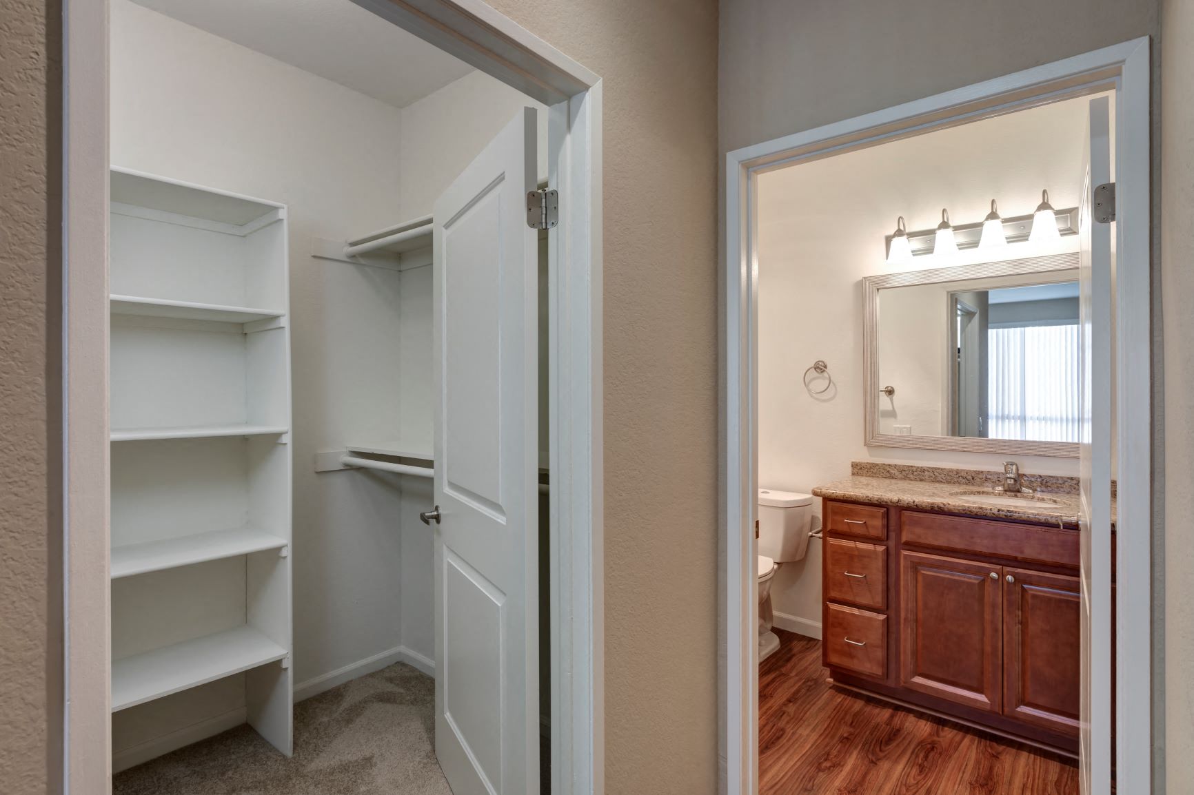 Two Bedroom Apartments in Hancock Park, CA - Apartment Walk-In Closet with View of Bathroom