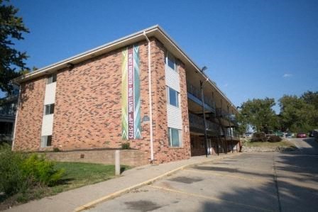 a brick building with banners on the side of it