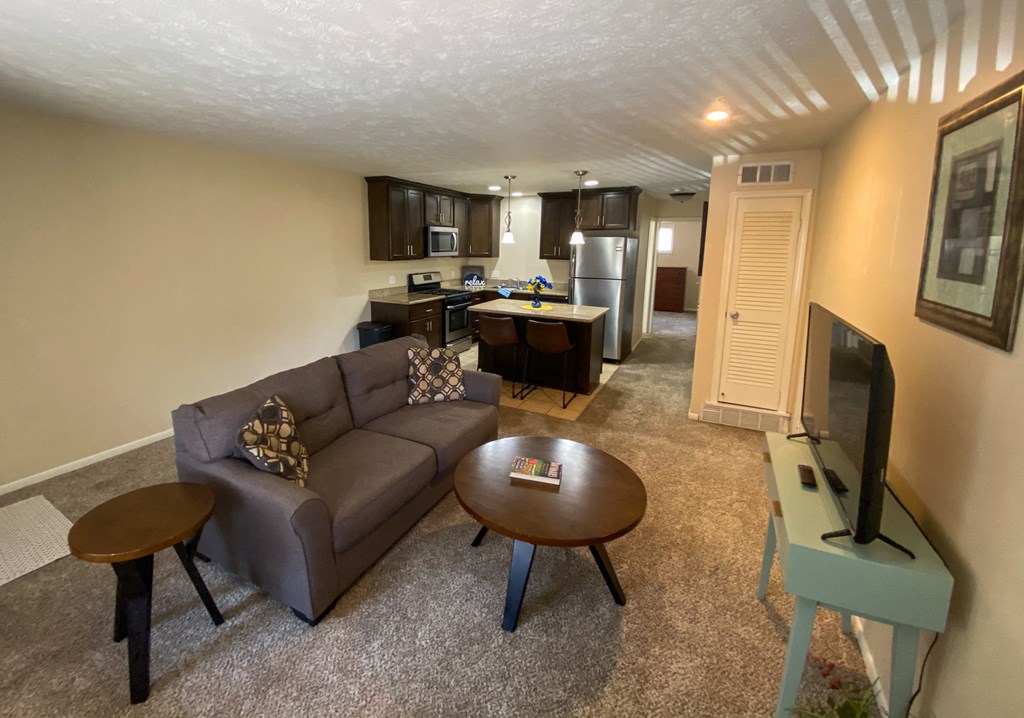 a living room with a couch and a table