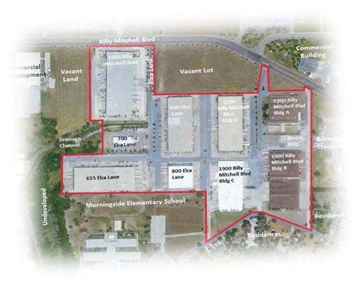an aerial view of a campus with a diagram of the buildings and parking lot