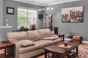 a living room with a couch and tables