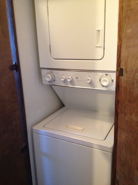 A white oven with a door and knobs on the side.