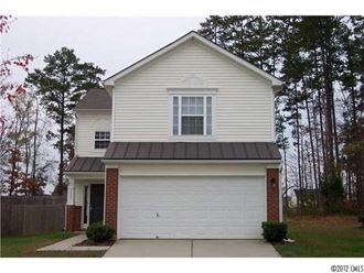 a white house with a white garage door