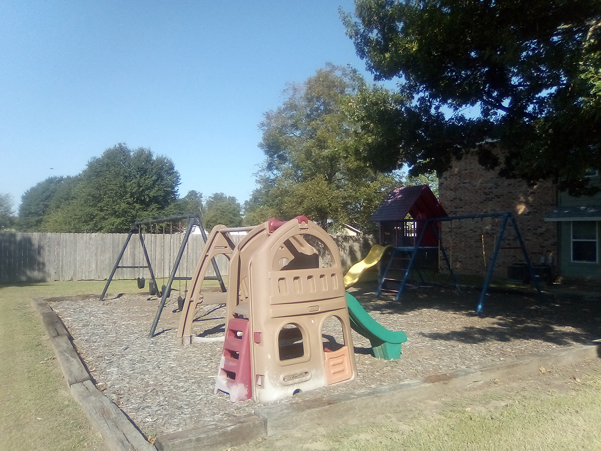 Countrywood Apartments playground, Reno, TX