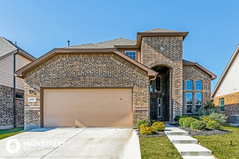 a house with a garage door in front of it