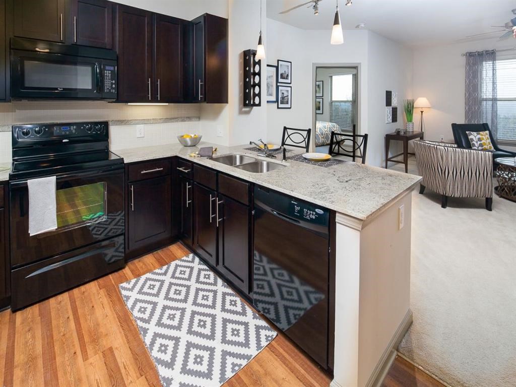 a kitchen with a sink and a counter top