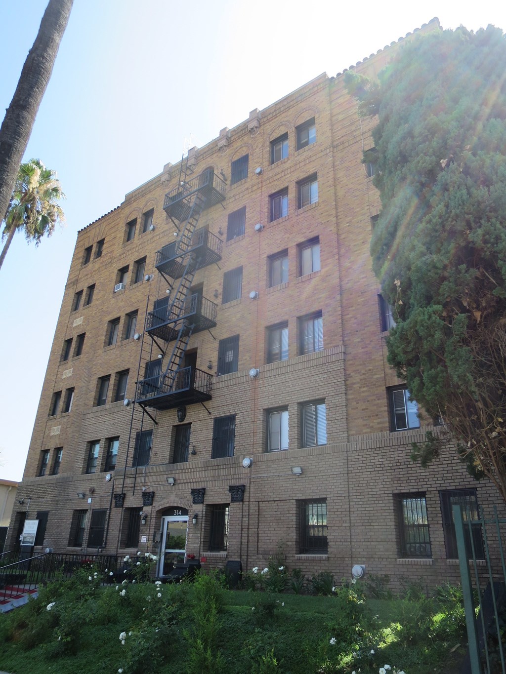 a tall building with a fire escape on the side of it
