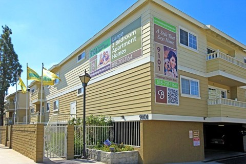 Apartment building with a sign that says "Lantern Room Bed & Breakfast Apartments".