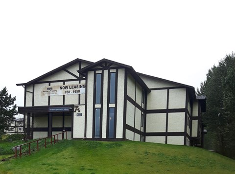 a white and black building with a sign on it
