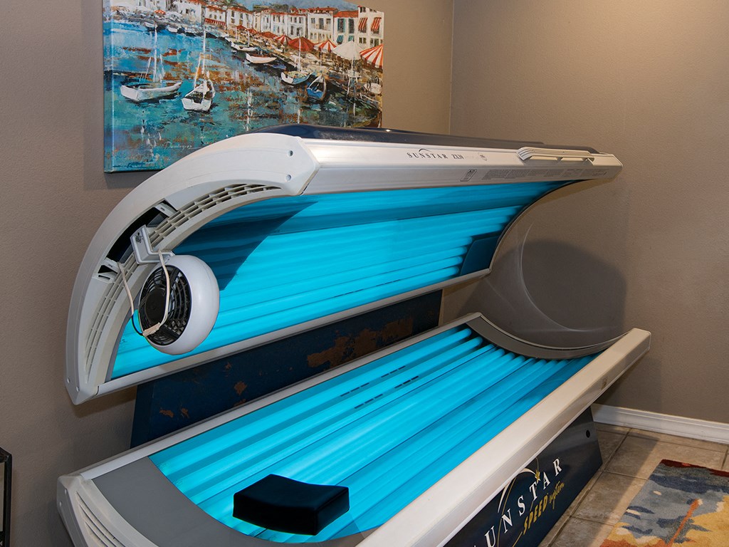 a spa room with a massage bed and a massage boat