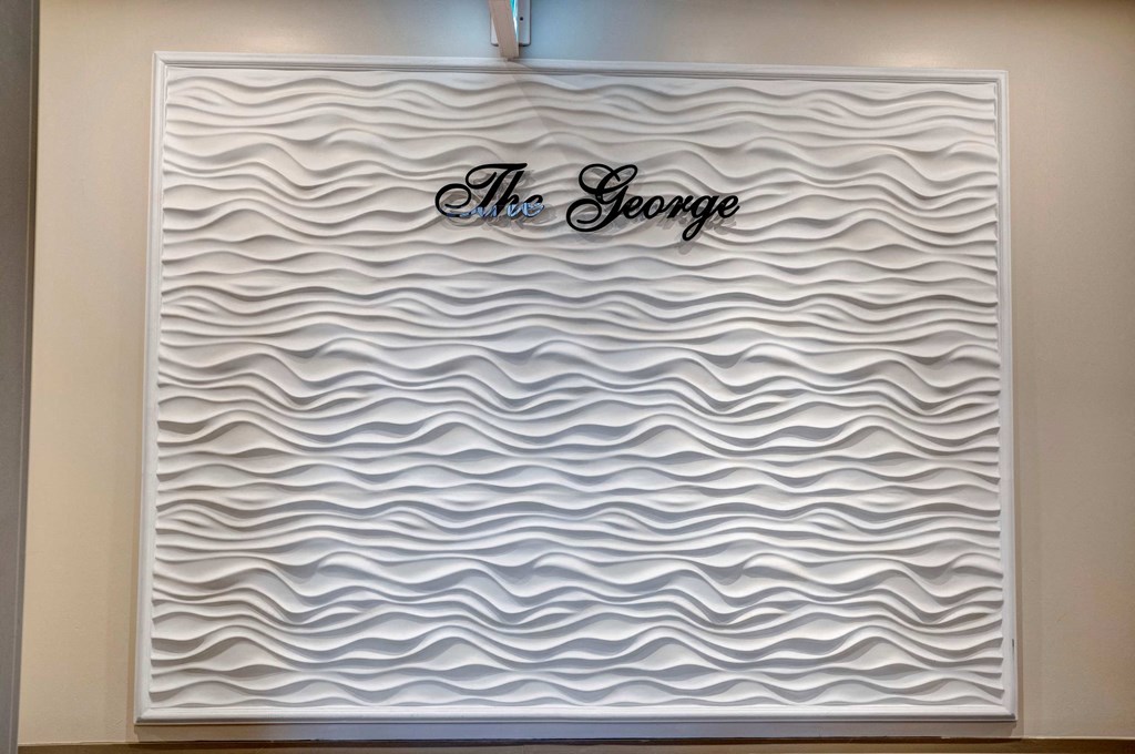 a wall with a sign that reads the escape on it