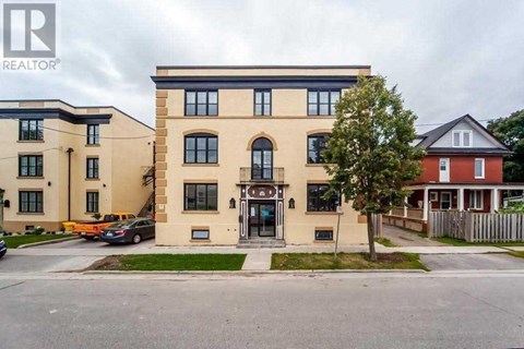 the front of a building with a street in front of it
