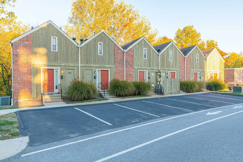 a row of houses with a parking lot
