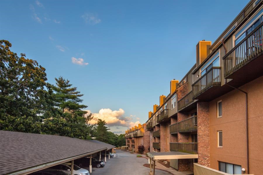 a view of a courtyard between two apartment buildings