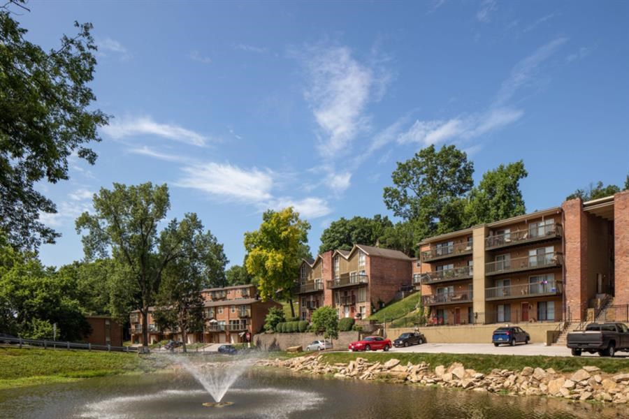 an apartment building with a water fountain