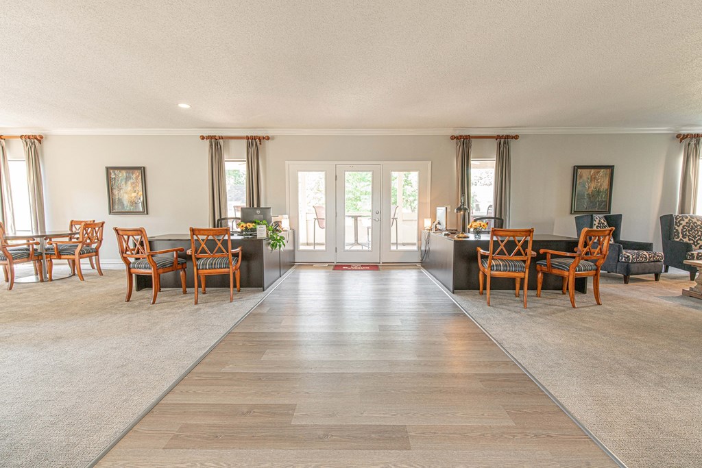the living room and dining room of a house