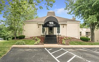 a white building with a black awning
