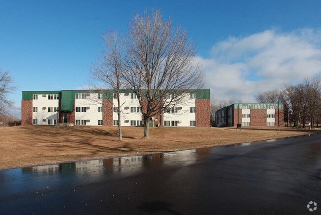 a large building with a tree in front of it