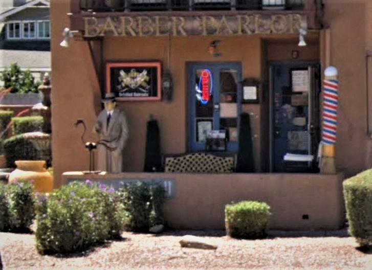 a restaurant with a statue in front of it