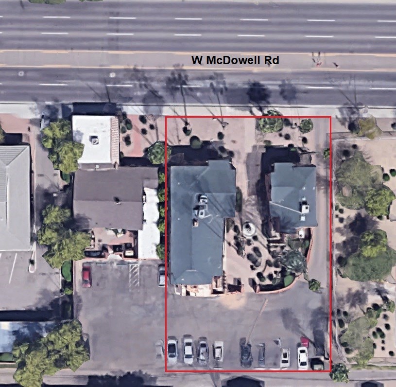 an aerial view of the parking lot with a red