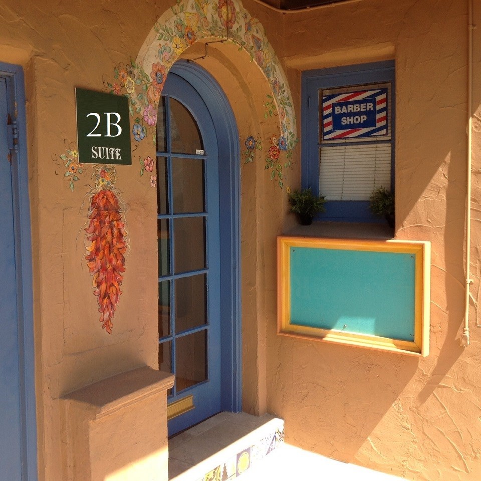 an arched window with a window seat and a pool