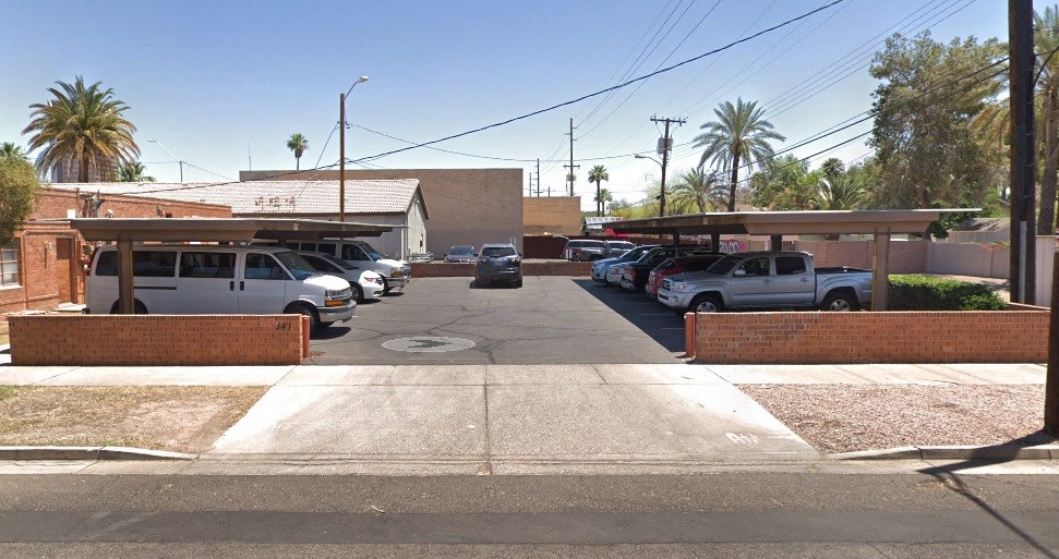 a row of cars parked in a parking lot