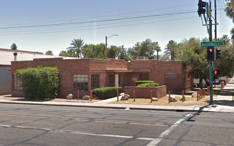 a red brick building on the corner of a street