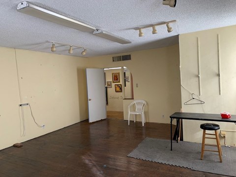 an empty room with a table and a chair