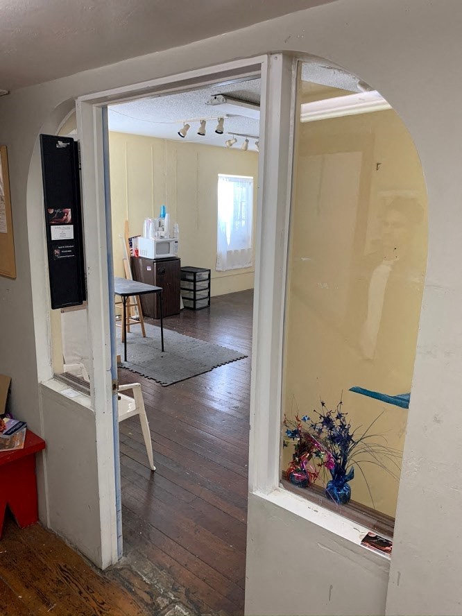 an open doorway into a room with a glass door