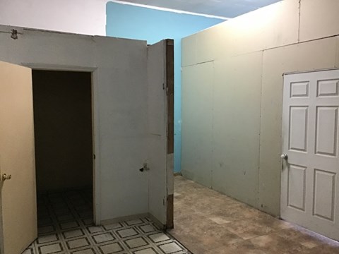 the bathroom is being remodeled and the walls are being primed