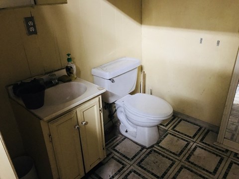 a bathroom with a toilet and a sink